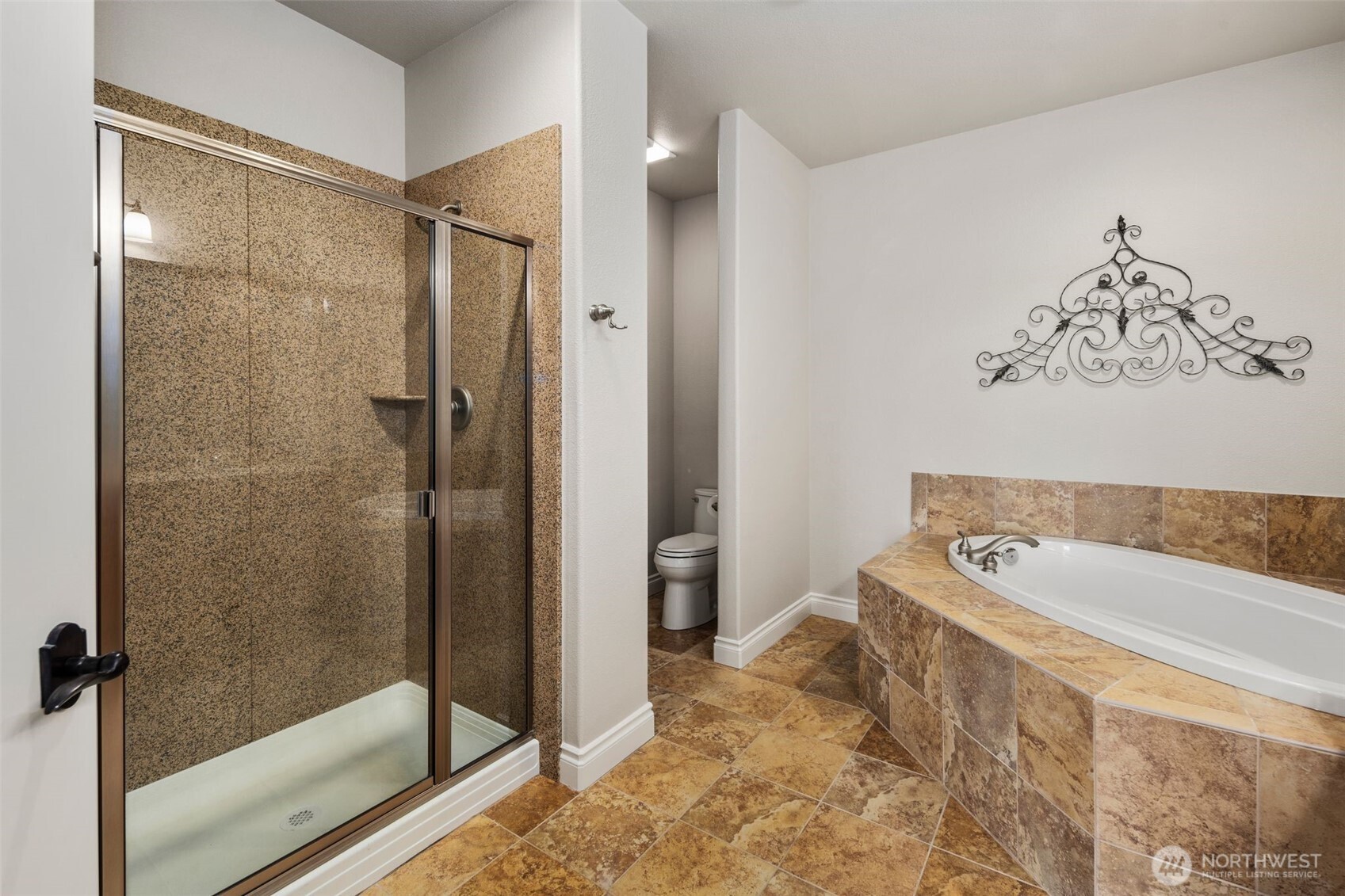 3224 Overlook Loop Ilwaco, WA 98624 - Photo 33 of 40 a bathroom with a tub a window and a glass door shower