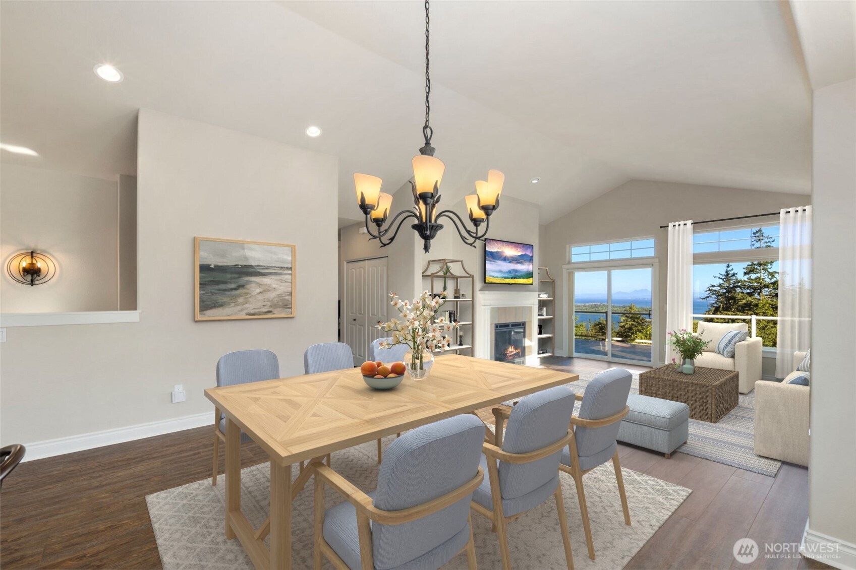 3224 Overlook Loop Ilwaco, WA 98624 - Photo 10 of 40 a dining room with furniture a chandelier and wooden floor