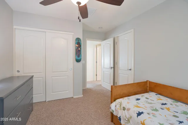 a bedroom with a bed and a cabinets