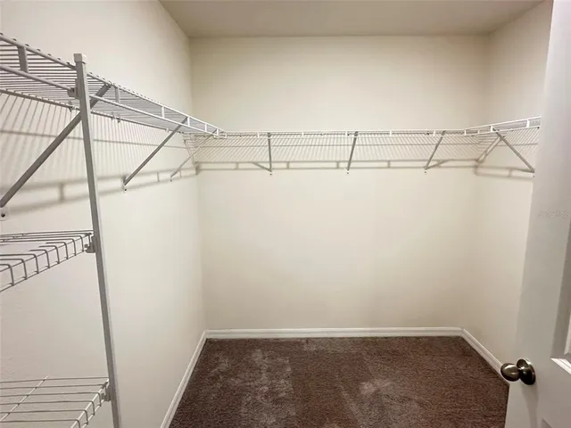 a view of a room with racks on the wall