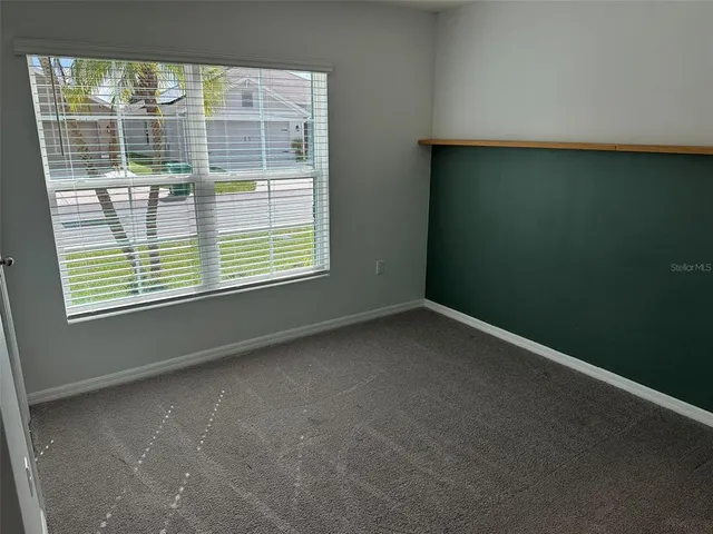 a view of a room that has a window in it