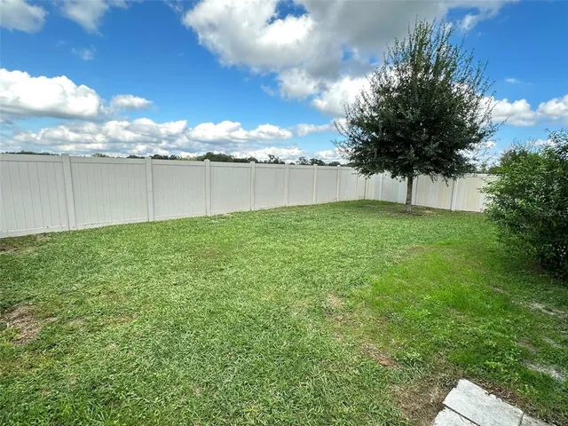 a view of a backyard of the house