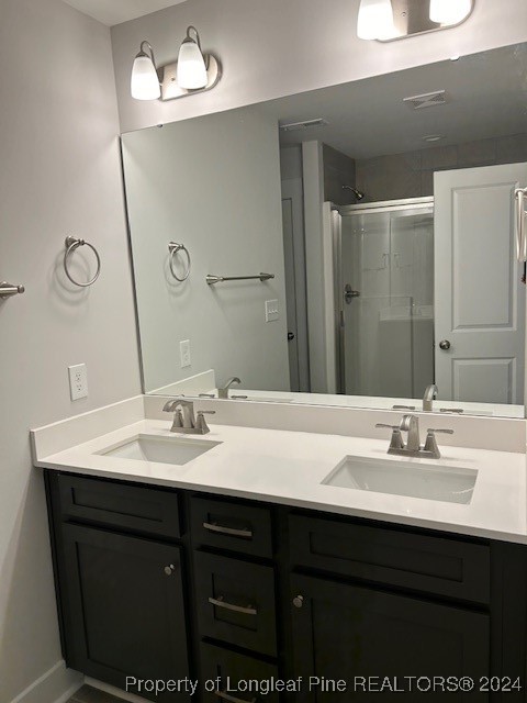 1113 Dean Road St. Pauls, NC 28384 - Photo 18 of 29 a bathroom with a sink vanity and mirror