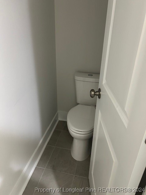 1113 Dean Road St. Pauls, NC 28384 - Photo 20 of 29 a white toilet sitting next to a shower