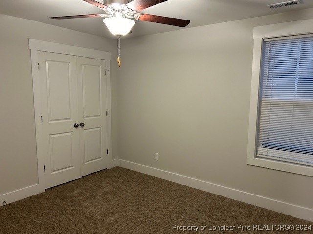 1113 Dean Road St. Pauls, NC 28384 - Photo 28 of 29 an empty room with windows and fan