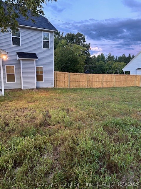 1113 Dean Road St. Pauls, NC 28384 - Photo 3 of 29 a view of a backyard with large trees