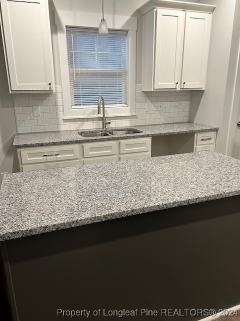 1113 Dean Road St. Pauls, NC 28384 - Photo 10 of 29 a kitchen with kitchen island granite countertop white cabinets and a granite counter tops
