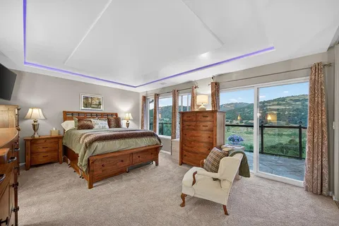 a room with lots of furniture and a large window