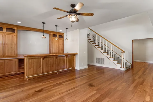 a view of an entryway with wooden floor