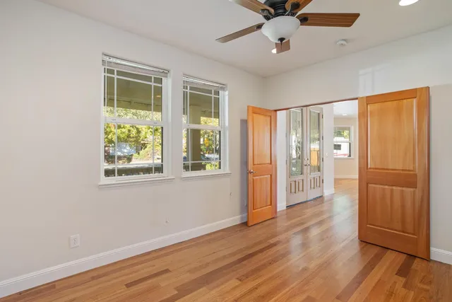 a view of an entryway with wooden floor