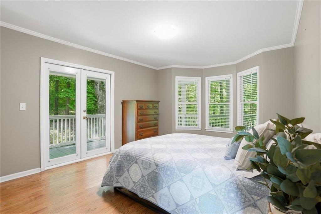3259 Etchison Road Loganville, GA 30052 - Photo 17 of 50 a bed sitting in a spacious bedroom next to a window