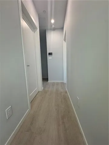 a bathroom with a shower sink and mirror