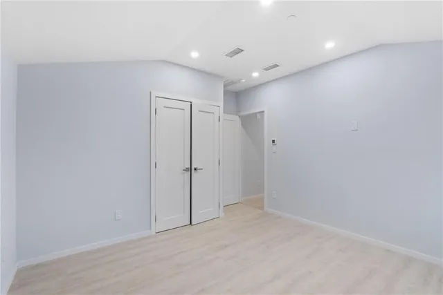 a city view from a balcony with furniture