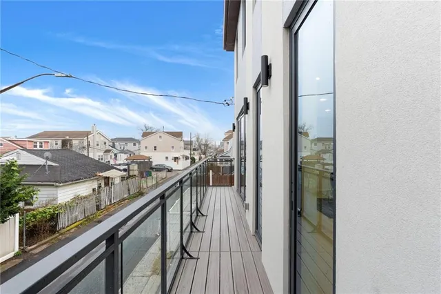 a view of a balcony with wooden floor