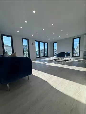 a lobby with a couch and a rug