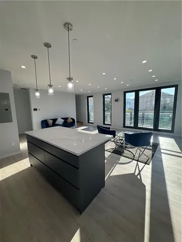 a large room with lots of furniture and a wooden floor