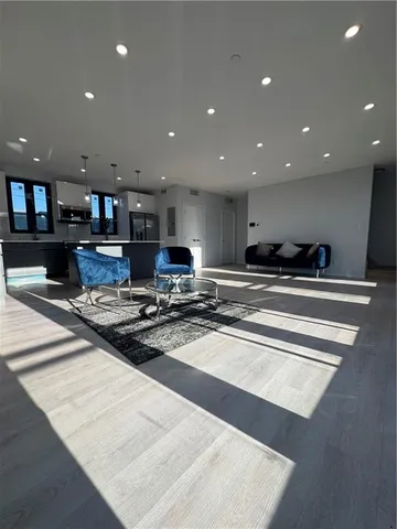 a kitchen with stainless steel appliances granite countertop a sink stove and a granite counter top