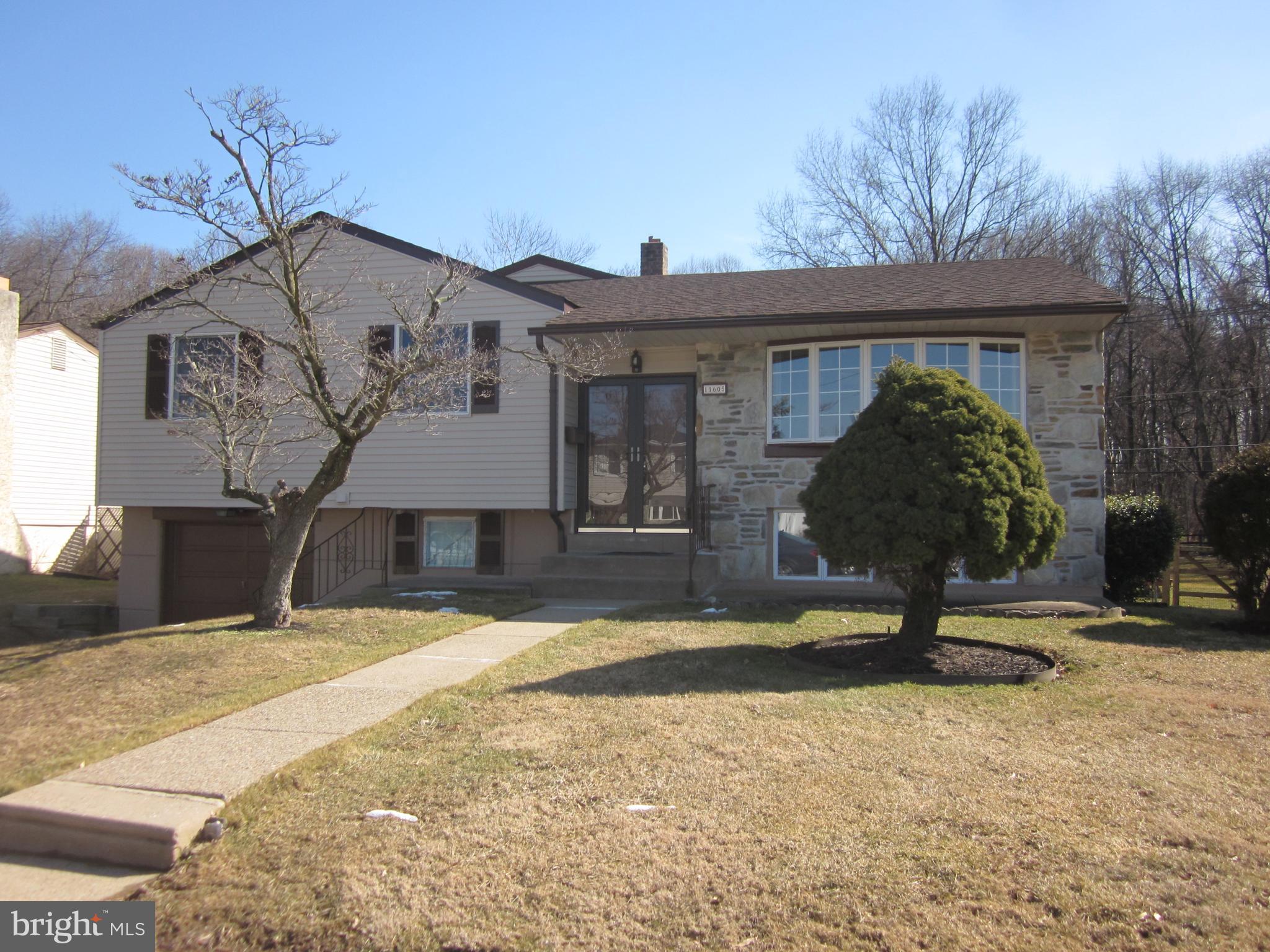11605 Stevens Road Philadelphia, PA 19116 - Photo 1 of 44 a front view of a house with garden