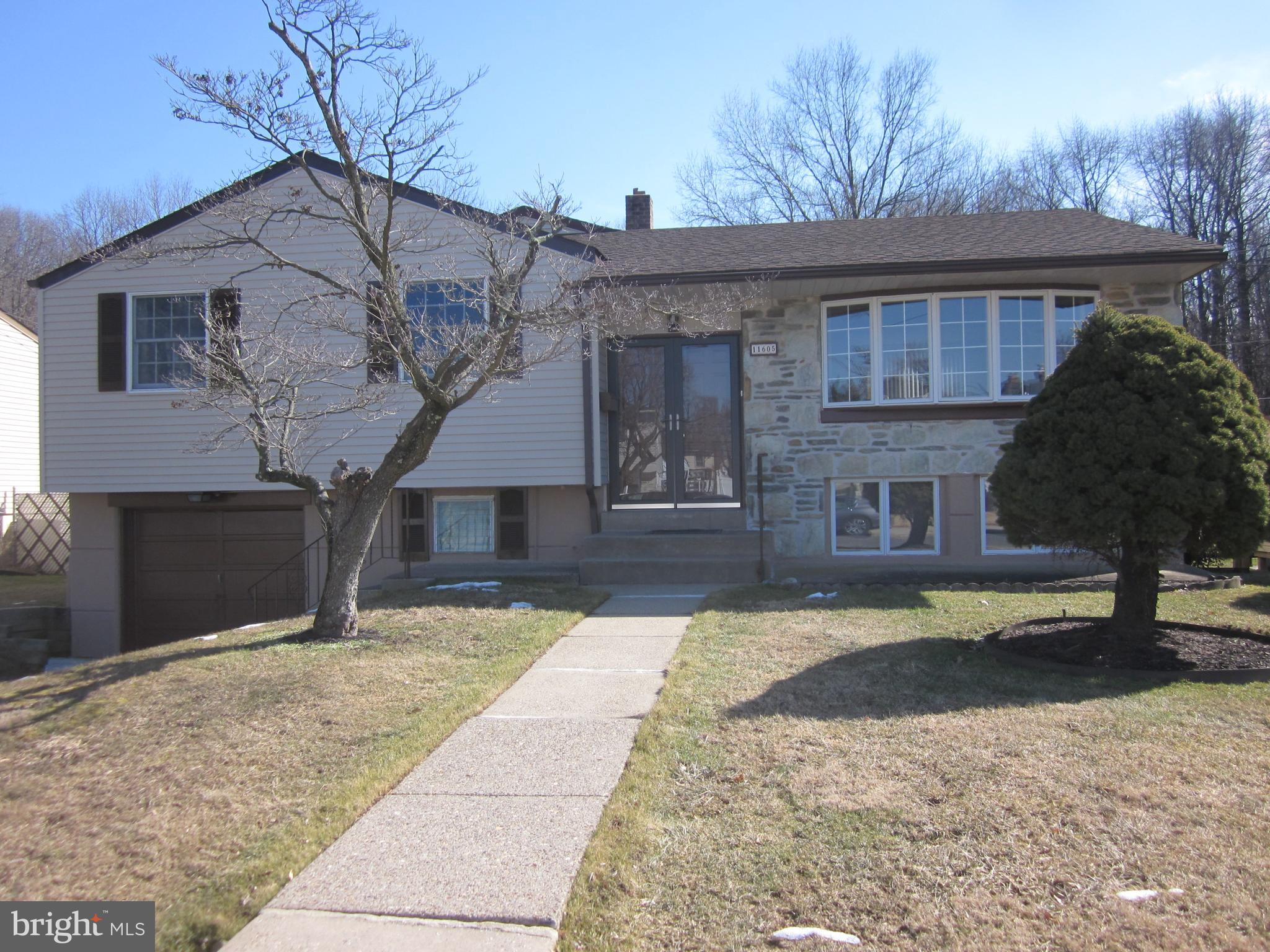 11605 Stevens Road Philadelphia, PA 19116 - Photo 2 of 44 a front view of a house with a yard