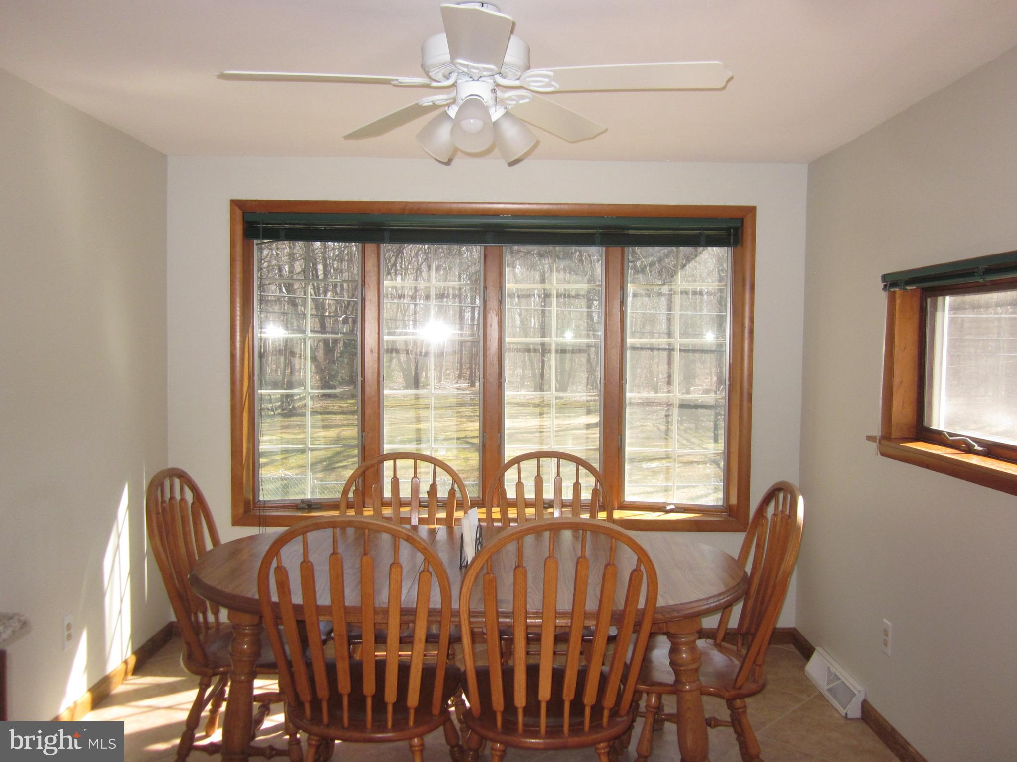 11605 Stevens Road Philadelphia, PA 19116 - Photo 14 of 44 a view of a dining room with furniture window and outside view