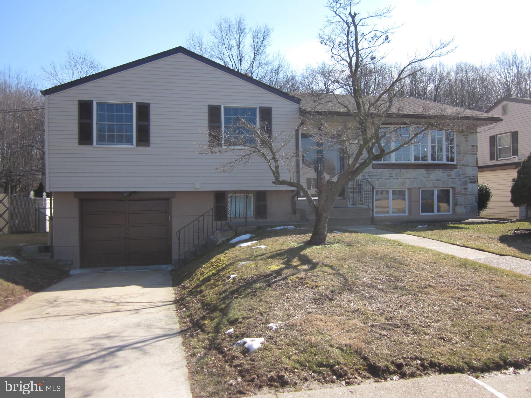 11605 Stevens Road Philadelphia, PA 19116 - Photo 3 of 44 a house that has a tree in front of it