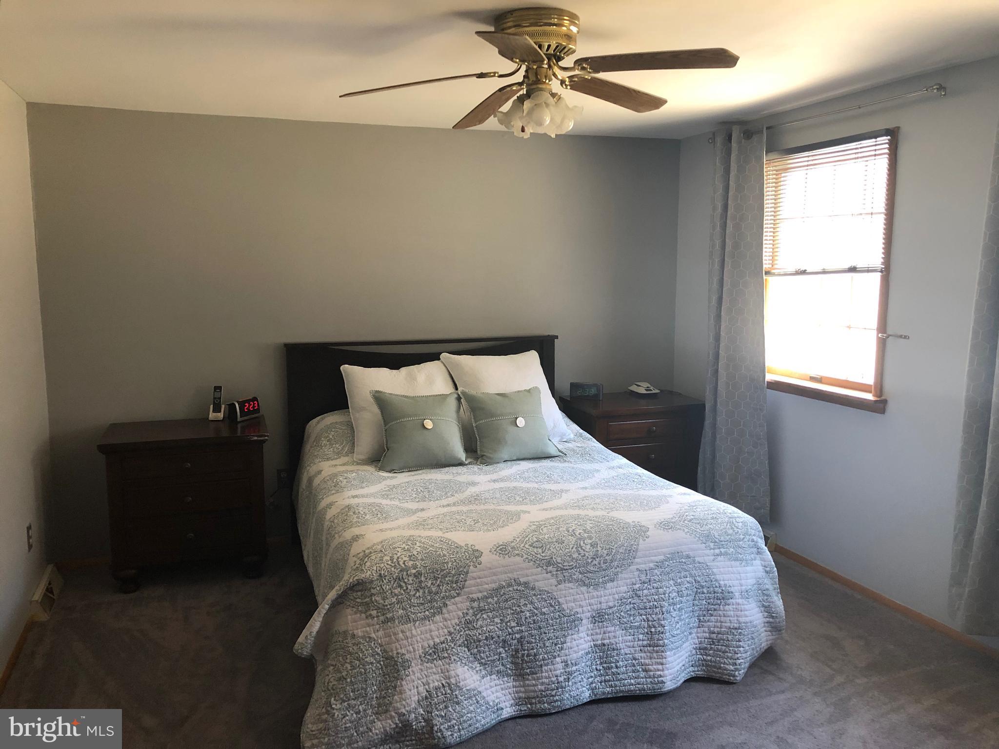 11605 Stevens Road Philadelphia, PA 19116 - Photo 21 of 44 a large bed sitting in a bedroom next to a window