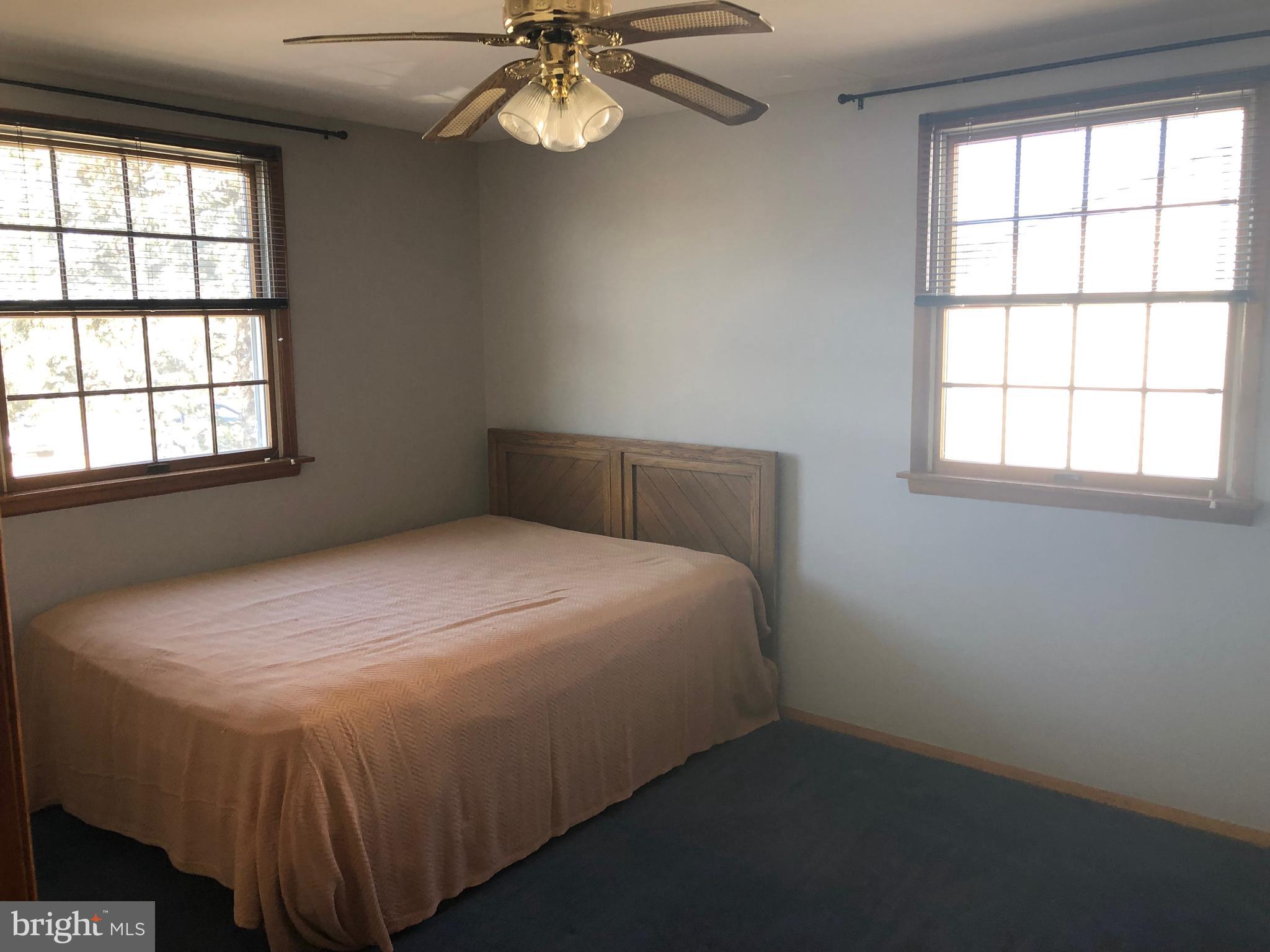 11605 Stevens Road Philadelphia, PA 19116 - Photo 30 of 44 a bedroom with a bed and window