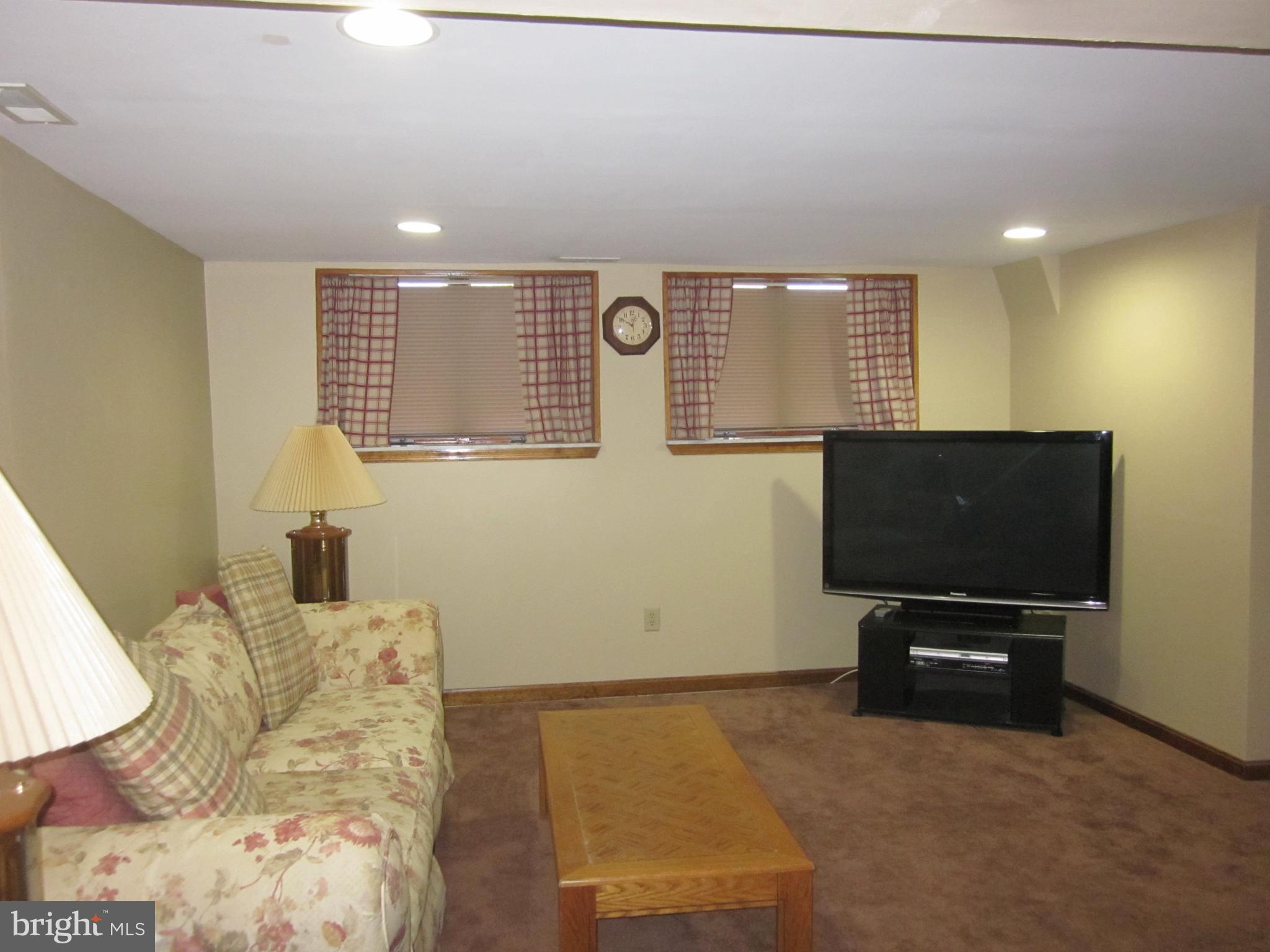 11605 Stevens Road Philadelphia, PA 19116 - Photo 32 of 44 a living room with furniture and a flat screen tv