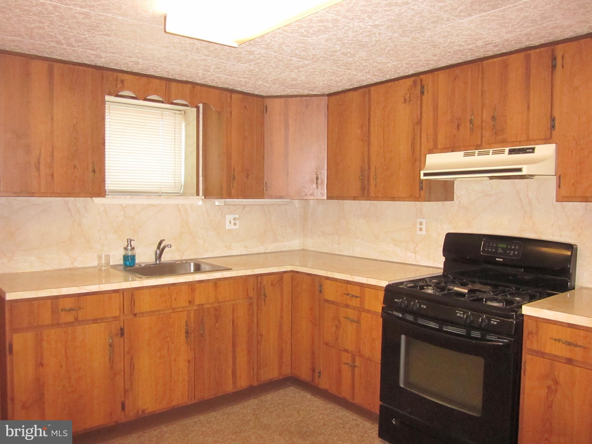 11605 Stevens Road Philadelphia, PA 19116 - Photo 35 of 44 a kitchen with a stove and a sink