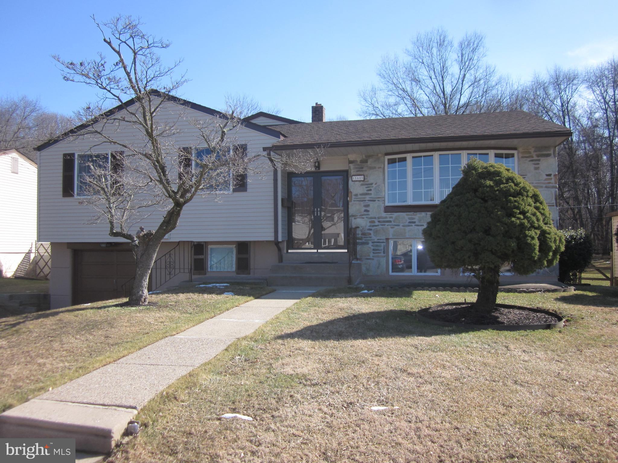 11605 Stevens Road Philadelphia, PA 19116 - Photo 5 of 44 a front view of a house with a yard