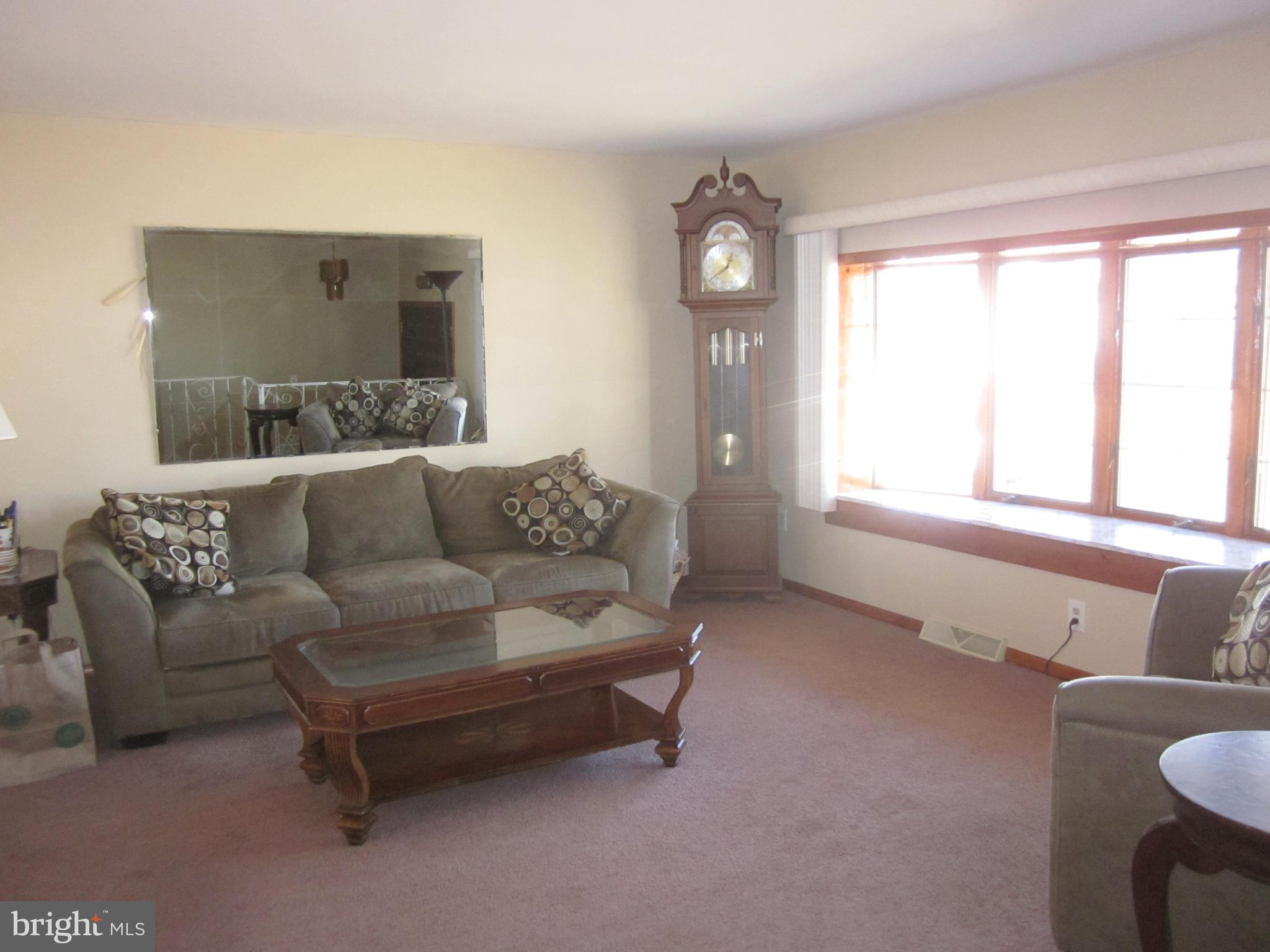 11605 Stevens Road Philadelphia, PA 19116 - Photo 6 of 44 a living room with furniture and a large window