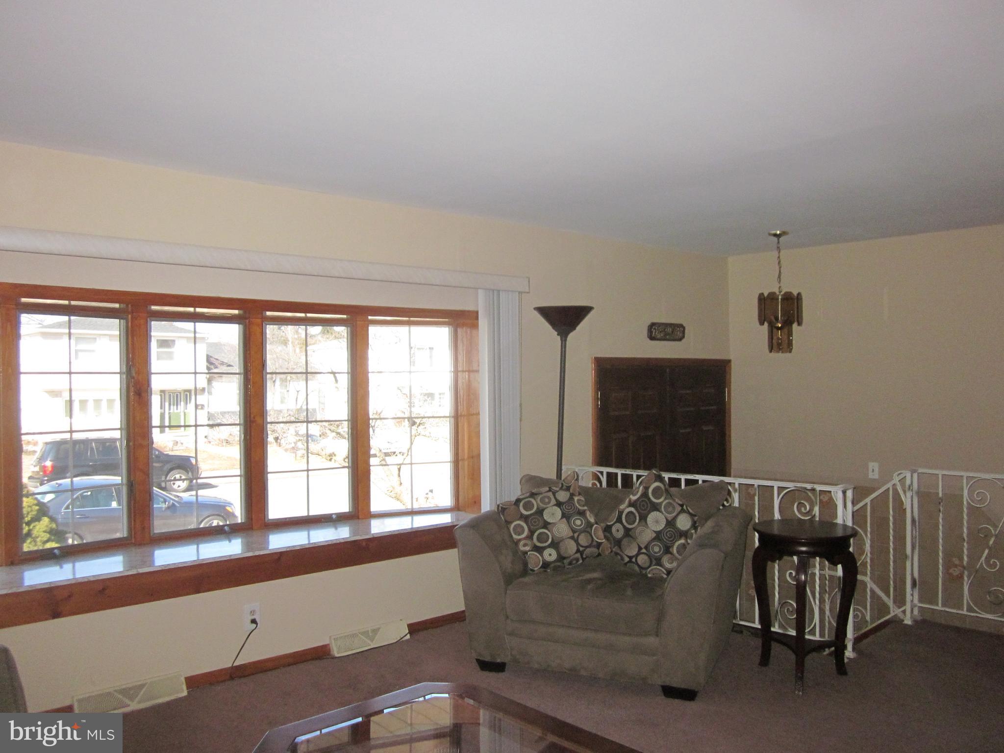 11605 Stevens Road Philadelphia, PA 19116 - Photo 7 of 44 a living room with furniture and a large window