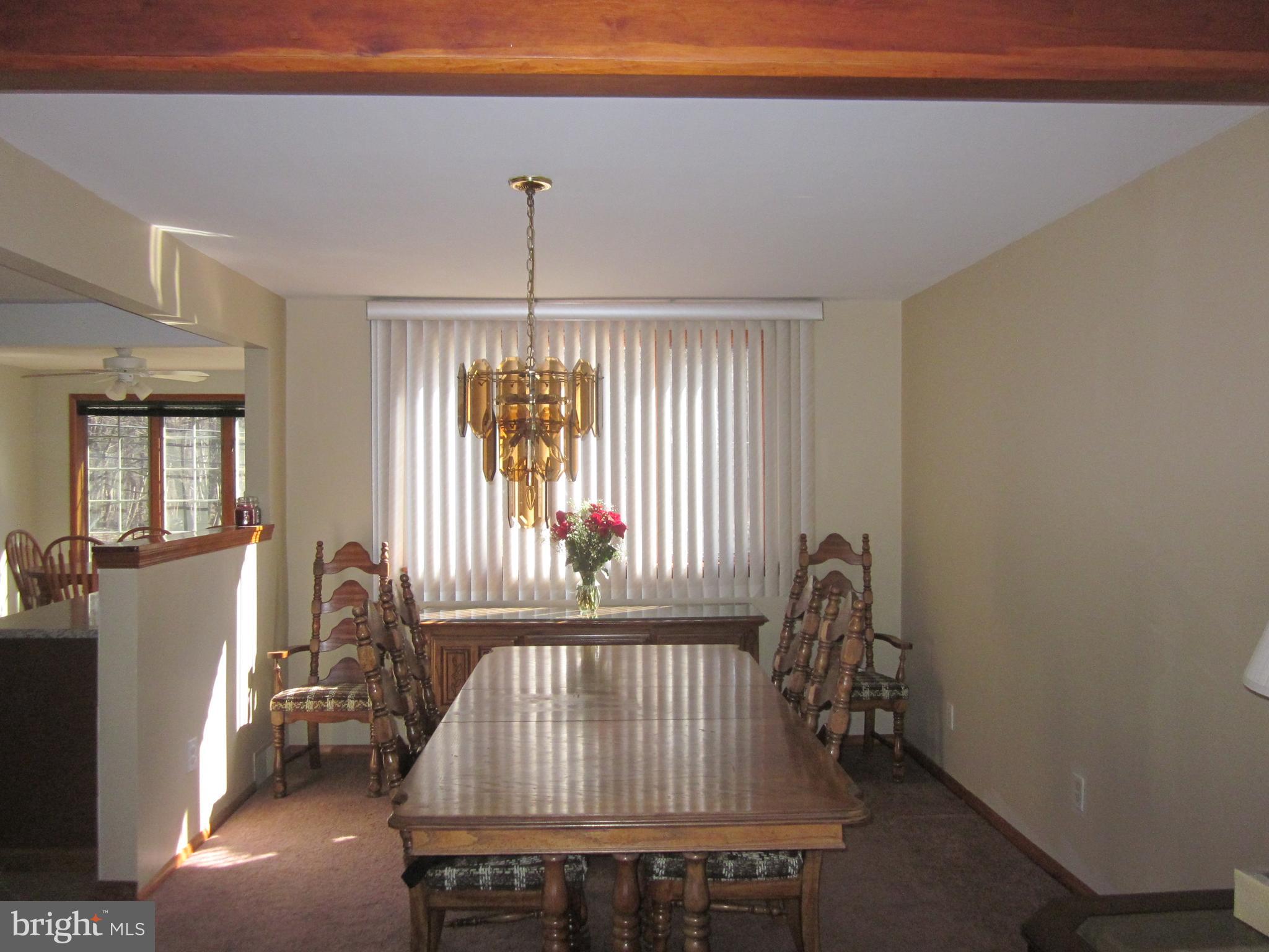 11605 Stevens Road Philadelphia, PA 19116 - Photo 9 of 44 a view of a hallway with furniture and floor to ceiling window