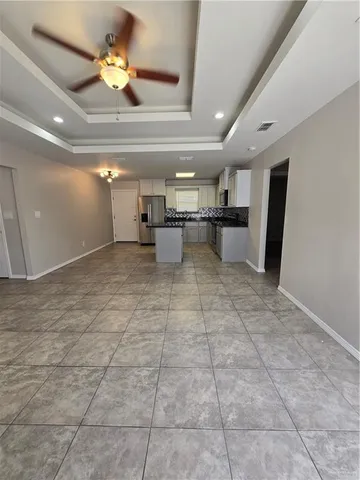 a view of a room with a kitchen