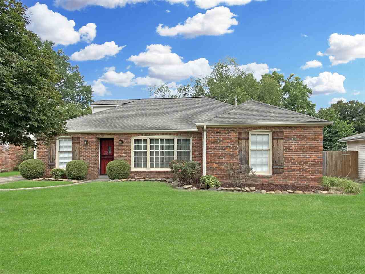 5588 Milford Road Memphis, TN 38120 - Photo 1 of 15 a view of a house with a garden