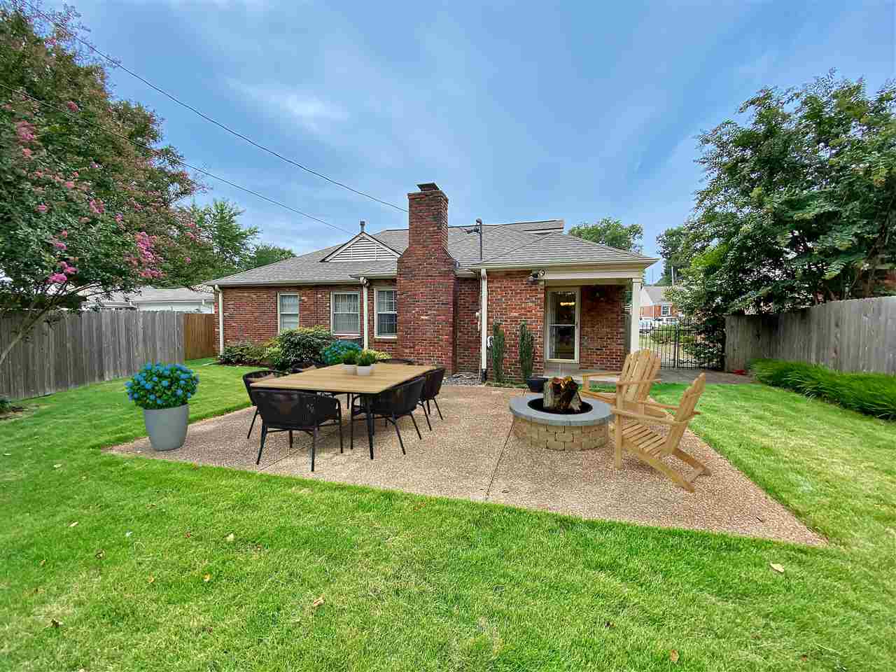 5588 Milford Road Memphis, TN 38120 - Photo 11 of 15 a view of a house with backyard and a slide
