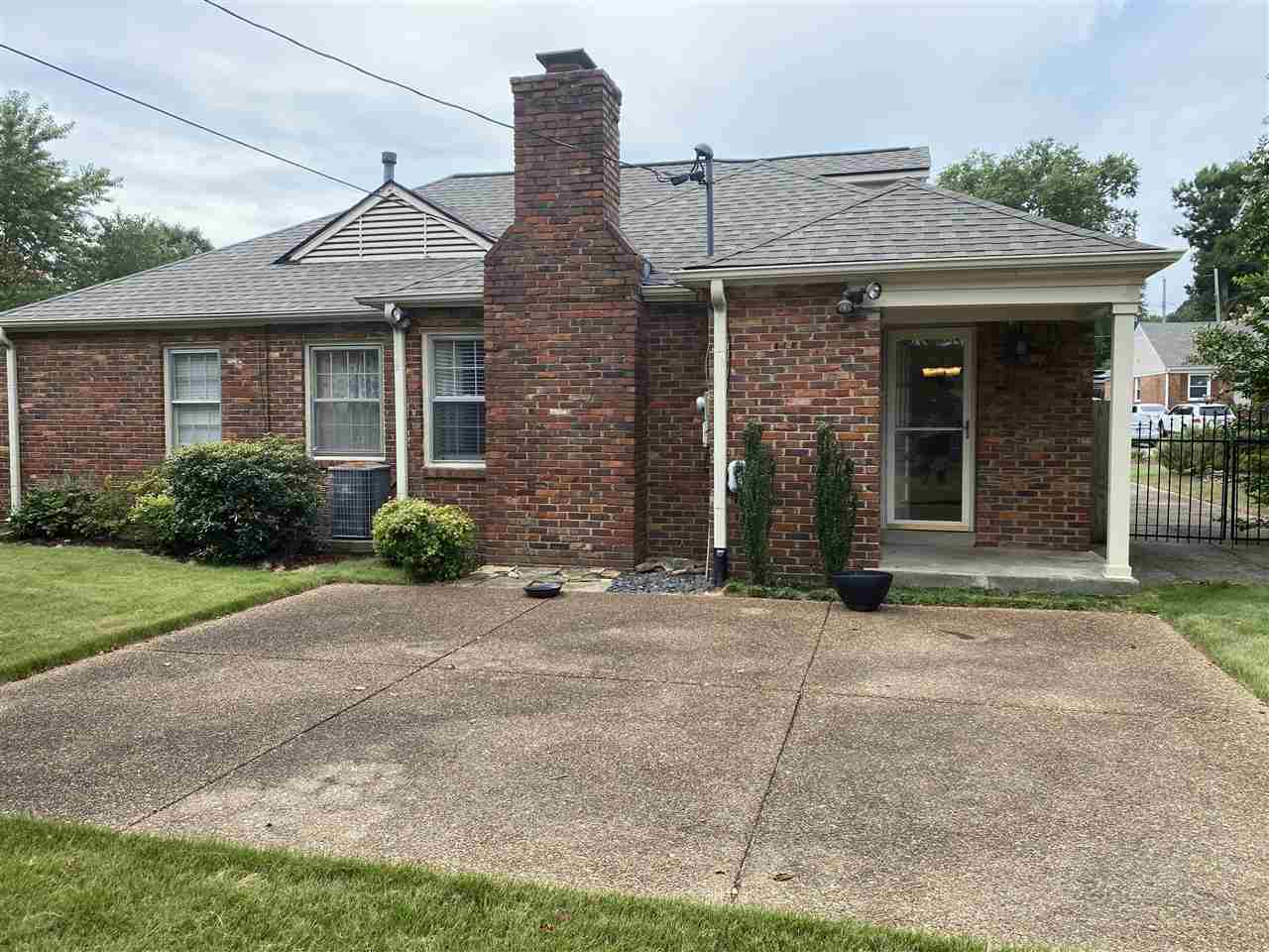 5588 Milford Road Memphis, TN 38120 - Photo 15 of 15 a front view of a house with garden