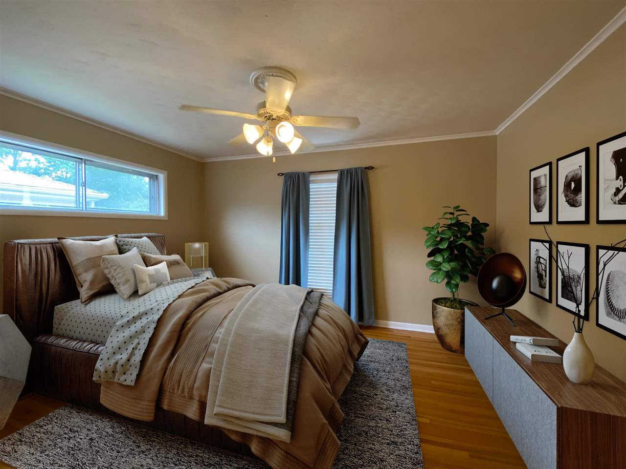 5588 Milford Road Memphis, TN 38120 - Photo 7 of 15 a bedroom with bed and a chandelier