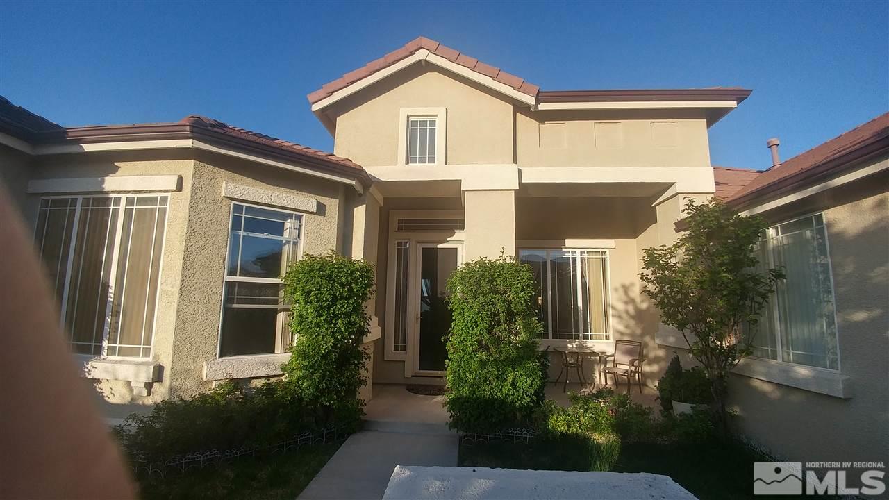 6386 Mesa Road Reno, NV 89511 - Photo 2 of 4 a front view of a house with garden