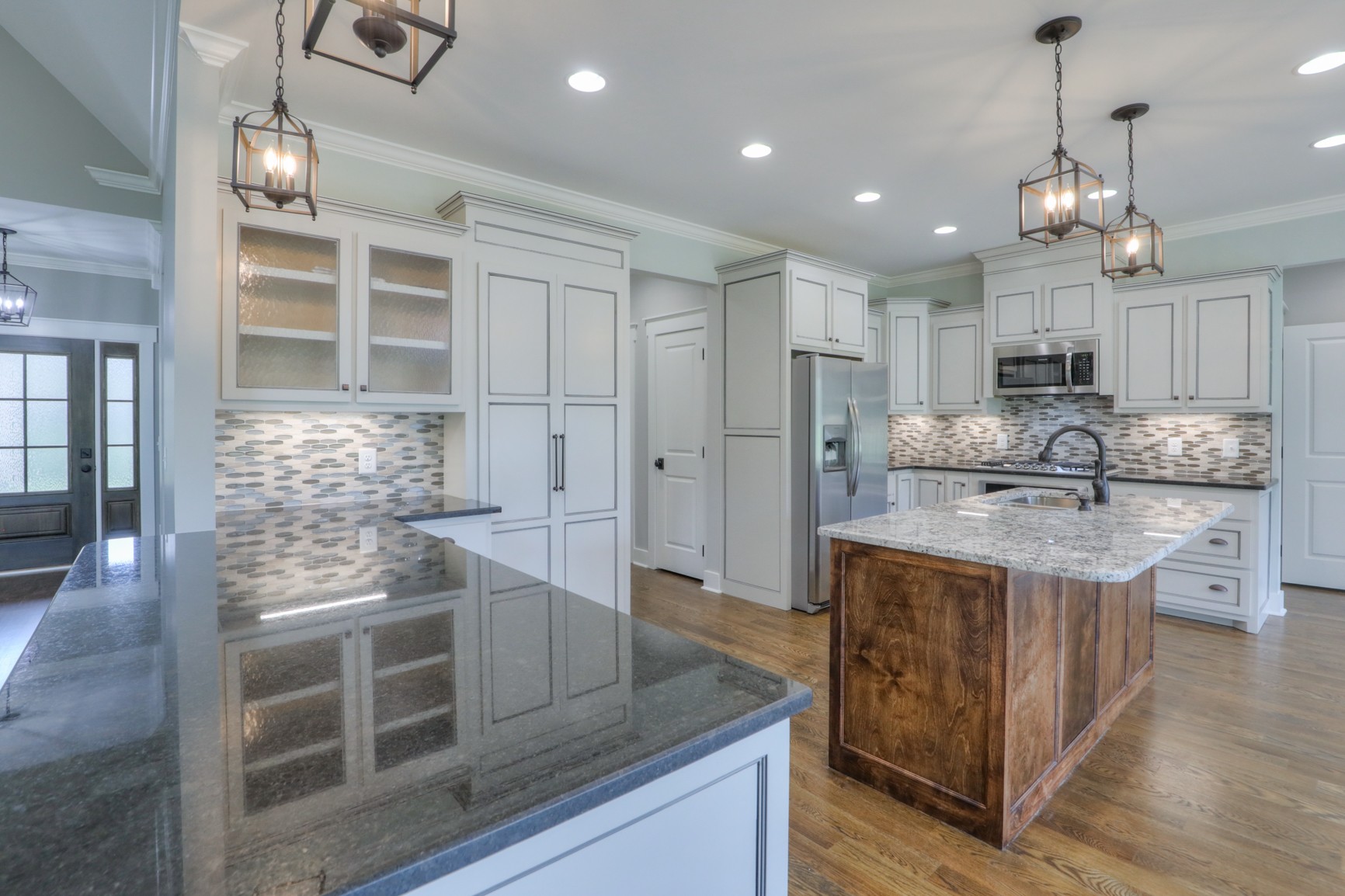 2363 Double Branch Road Columbia, TN 38401 - Photo 8 of 29 a kitchen with kitchen island granite countertop a stove and refrigerator