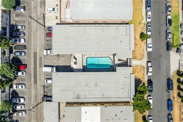 an aerial view of residential houses and outdoor space