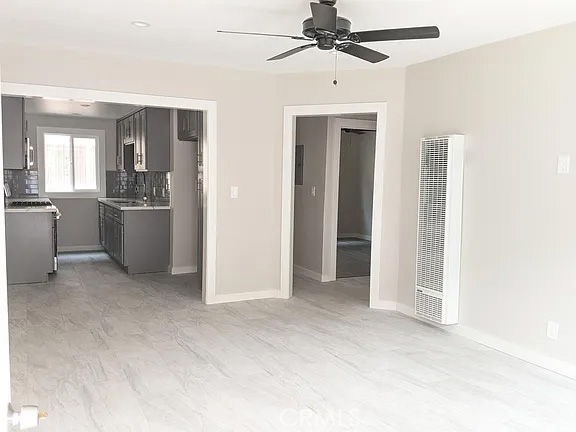 7370 Neo Street Downey, CA 90241 - Photo 22 of 38 a view of a kitchen with a sink cabinets and window