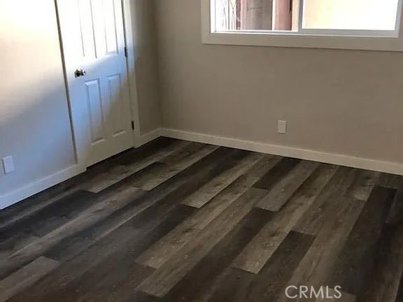 7370 Neo Street Downey, CA 90241 - Photo 31 of 38 a view of a closet area with wooden floor
