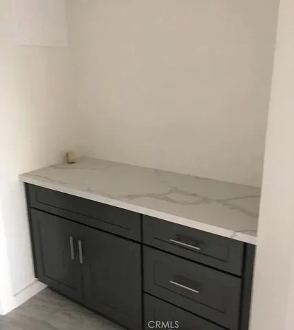 a bathroom with a sink and cabinets