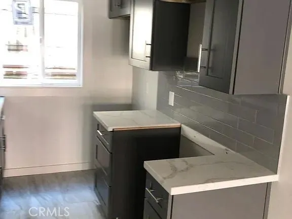 a kitchen with a stove and a microwave