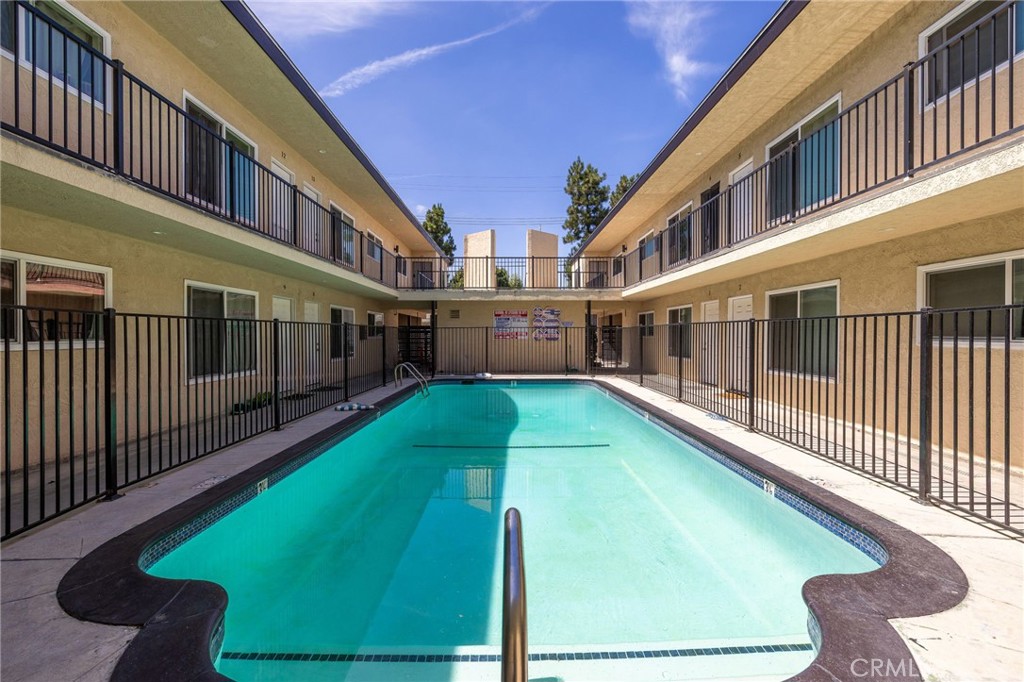 7370 Neo Street Downey, CA 90241 - Photo 9 of 38 a view of pool with two chairs next to a yard