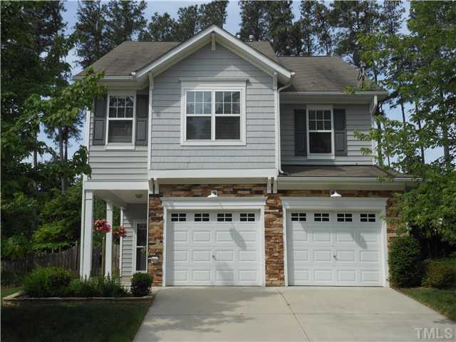 3414 Ranbir Drive Durham, NC 27713 - Photo 1 of 21 a front view of a house with a yard and garage