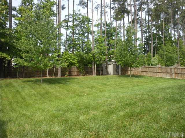 3414 Ranbir Drive Durham, NC 27713 - Photo 16 of 21 a view of a house with a backyard