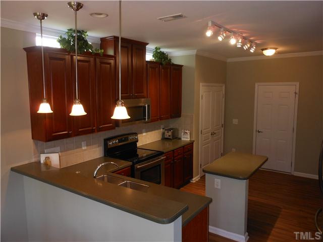 3414 Ranbir Drive Durham, NC 27713 - Photo 6 of 21 a bathroom with a sink and a mirror