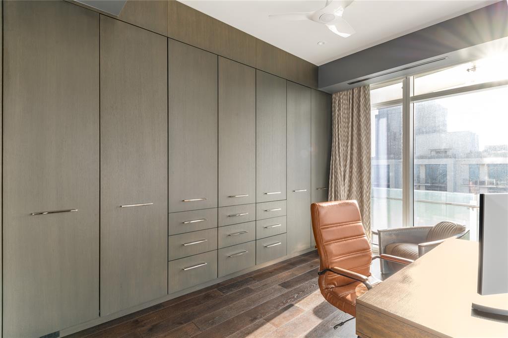 1918 Olive Street, Unit 3403 Dallas, TX 75201 - Photo 11 of 39 a living room with furniture and a floor to ceiling window